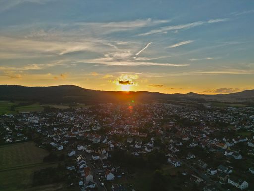 A beautiful sunset behind the mountains of a city