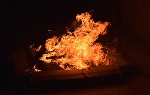 A large burning flame in campfire