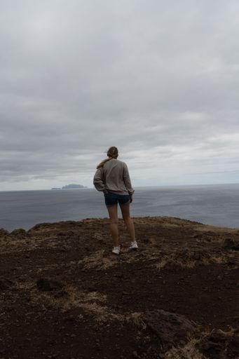 girl watch out to the ocean from Madeira island