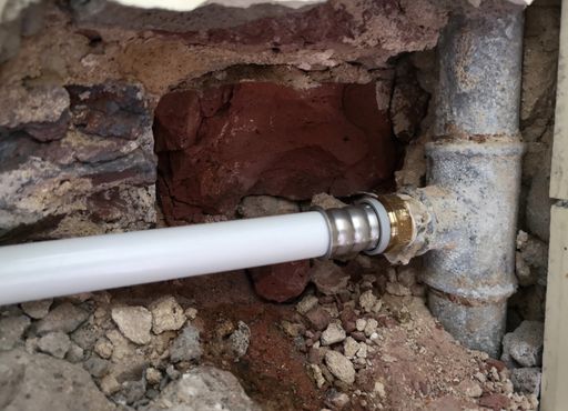 A shot of old water pipes in the wall