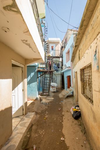 Old Corridor of Street Between Two Small Buildings