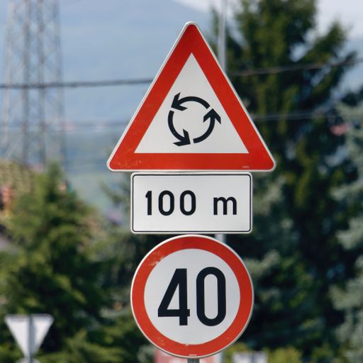 A close-up shot of the priority roundabout sign and the 40-speed limit