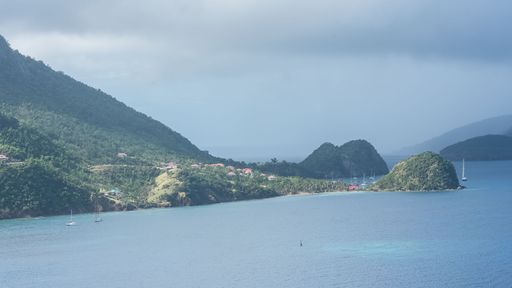 Terre-de-Haut Island in Guadeloupe, panorama of typical houses, the harbor in the bay with sailboats
