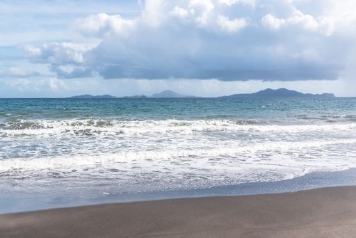 Basse Terre in Guadeloupe, the beach with the Saintes island in background