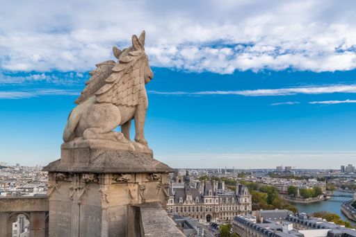 Sculptured lion which stays up the roofs of Paris, at the top of the tower Saint Jacques