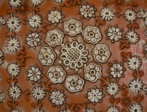 A closeup shot of a stone carving with floral design