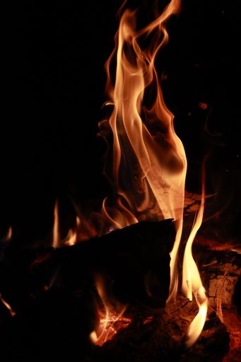 A vertical shot of the fire flames on black background