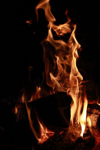 A vertical shot of the fire flames on black background