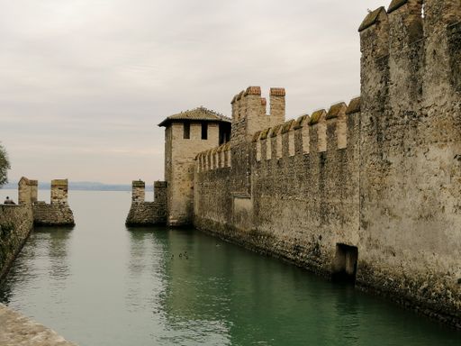 A beautiful scene of Desenzano castle walls surrounded by Garda lake, Brescia, Italy