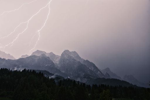 A dramatic lightning strike during a thunderstorm in the Steinberg in Leogang, Salzburg, Austria