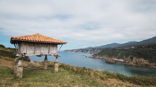 The chapel of La Regalina in Cadavedo, Asturias, Spain with a view to the sea