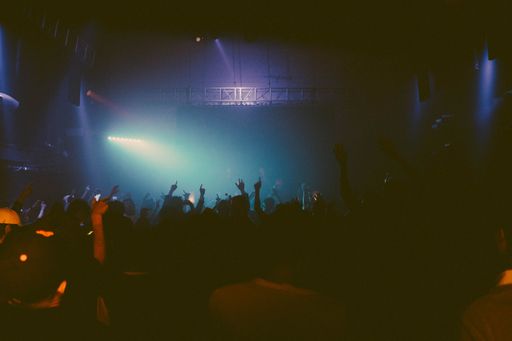 The young happy people dancing in club