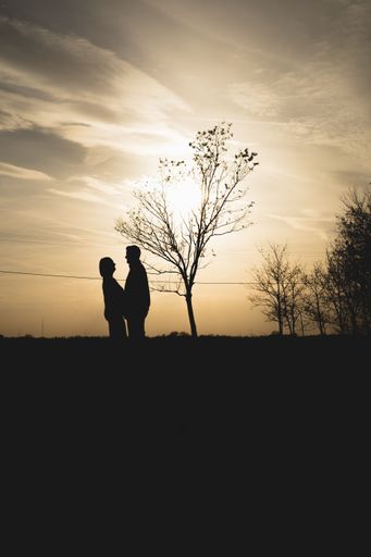 A silhouette of a couple at the sunset