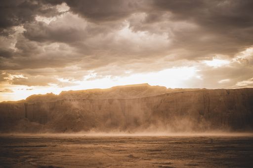 A scenic view of a beautiful dusty canyon against a cloudy sky