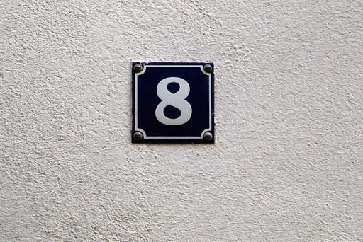 A closeup shot of the number sign of a house