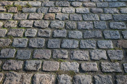 A high angle closeup shot of a brick sidewalk