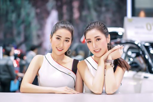 The attractive models pose with a car at The 36th Motor Expo Thailand 2019