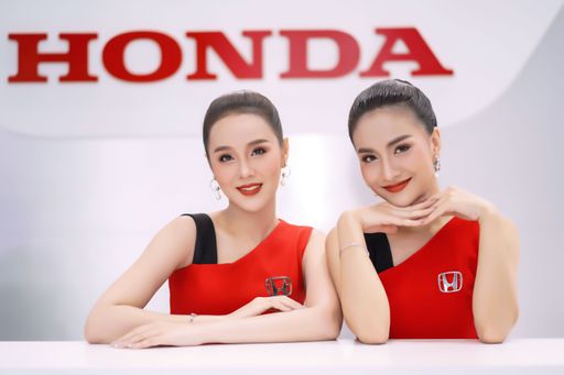 The portrait of two attractive models representing Honda Motor Company