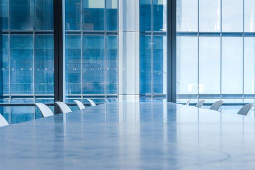 A conference meeting room in a glass building