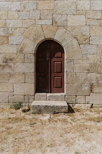 A vertical shot of an entry door of the Church of St. James in Portugal