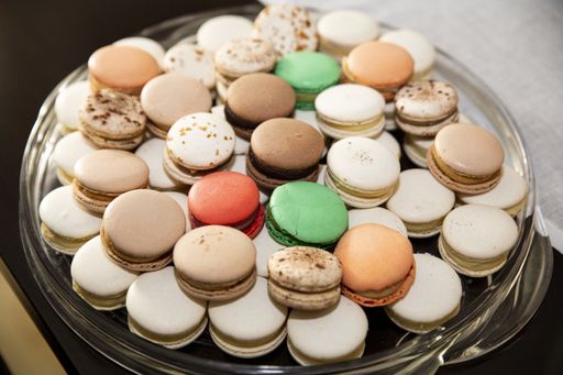 A high angle shot of a tray of different types of macaroons