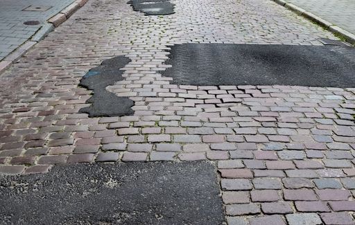 A closeup shot of an old historical cobblestone roads and walkways all over Europe