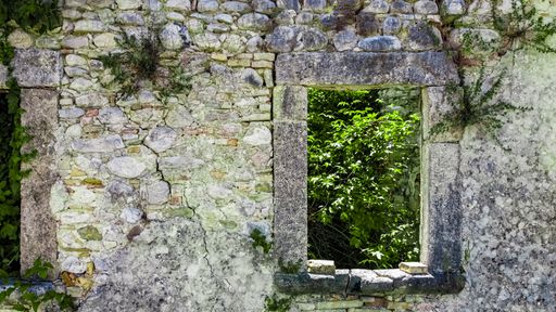Italy 2020: Aerial view of an abandoned window in Faraone Vecchio. Nature, slowly, is embracing deteriorating constructions. July 2020, Abruzzo