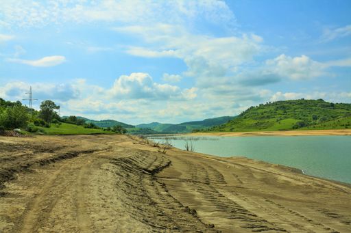 A Shore of a river with low water due to drought