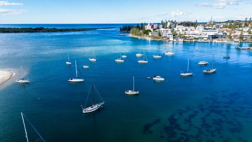 An aerial view of the city and boats in Port Macquarie, New South Wales, Australia