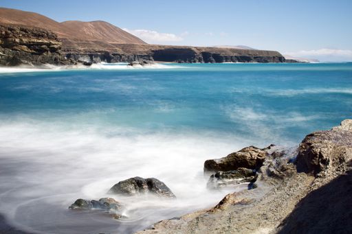 A beautiful shot of the shore and hills in Fuerteventura, Spain