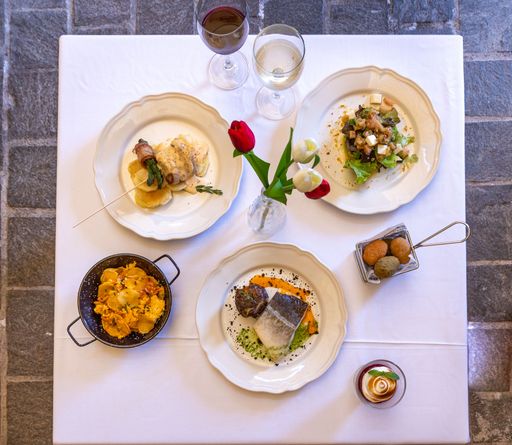 A top view of served dinner on the white table