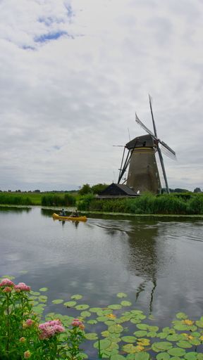 Kinderdijk Windmills Sunny and Cloudy Day with Nature and River