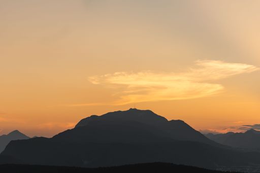 A silhouette of a hill with sunset behind it in Carinthia, Austria