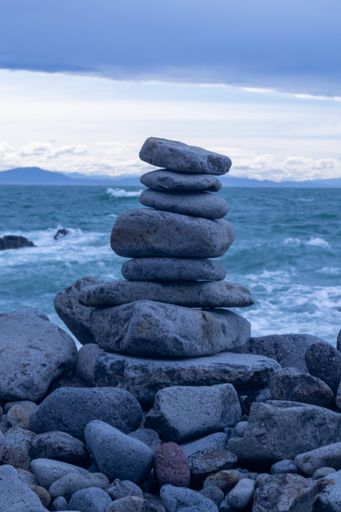 A vertical closeup of stones on top of each other.
