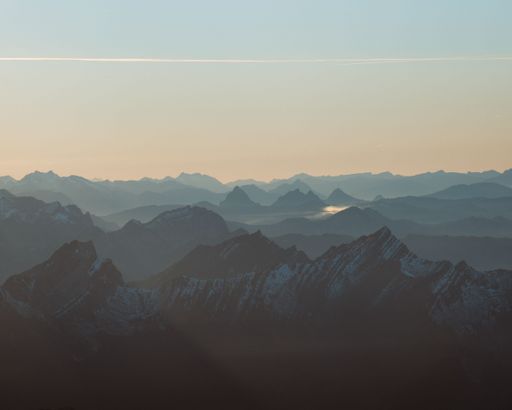 An aerial view of beautiful mountains during sunset