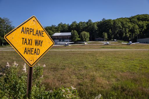 An airplane taxiway sign in the airport