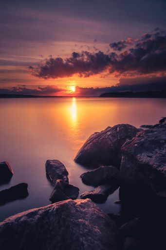 A vertical shot of a beach during a beautiful sunset - great for background