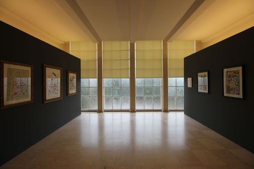 An interior with hanging pictures and empty hall of modern art museum of Serralves, Portugal