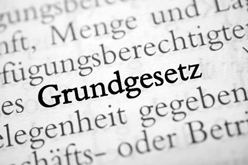 A closeup shot from the book of the word 'Grundgesetz' translated as constitution