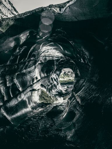A serene greyscale of an ice caving, Katla region of Iceland