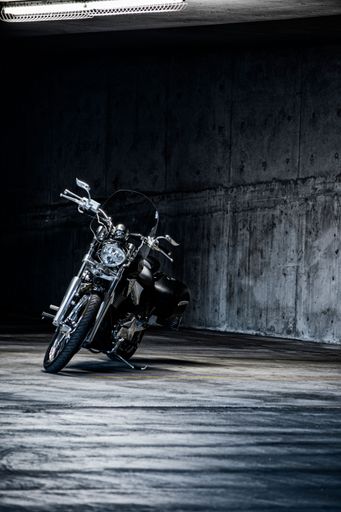 An elegant, black victory Motorcycle Parked in Garage