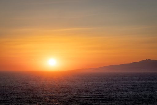 A dramatic sunset view over the sea water