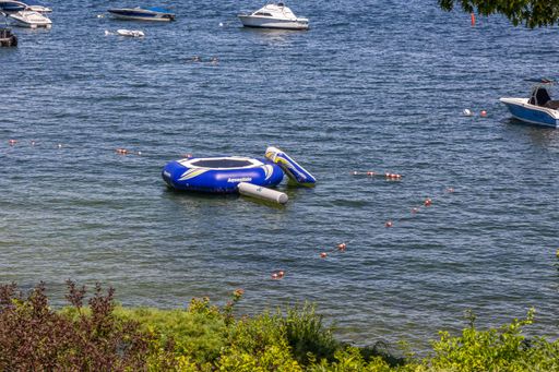 An aerial view of floating boat in lake Winnipesaukee