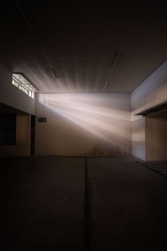 Ray of sunlight shining through a window into a garage in Horgen, Switzerland