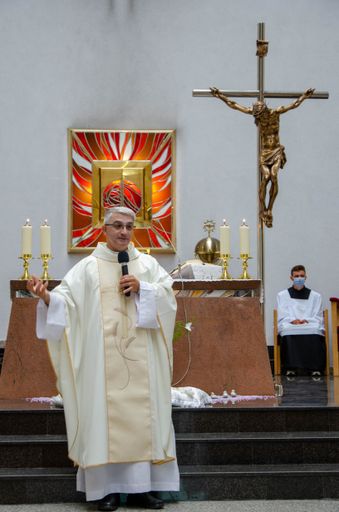 A vertical shot of a priest during Mass - central act of worship in Trencin, Slovakia