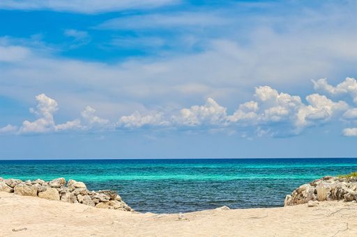 A landscape shot of the beautiful sandy beach at the Riviera Maya Caribbean coastline in Mexico