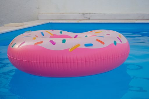 A closeup shot of a donut-shaped inflatable in a swimming pool