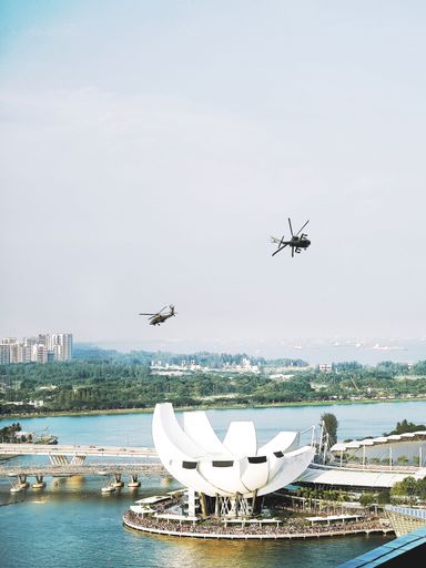 A bird's eye view of helicopters flying over Singapore on National Day Parade