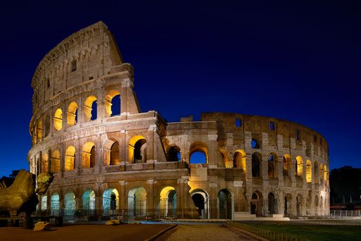 A beautiful view of the Colosseum in the city of Rome, Italy at twilight