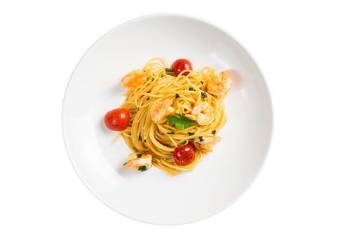 A plate of spaghetti with tomatoes and seafood on the white background